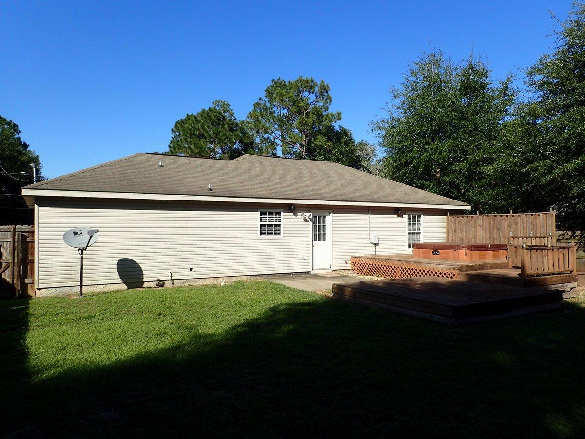 134 Hampton Drive Crestview, FL 32539 - Photo 14 of 17 a view of house with yard