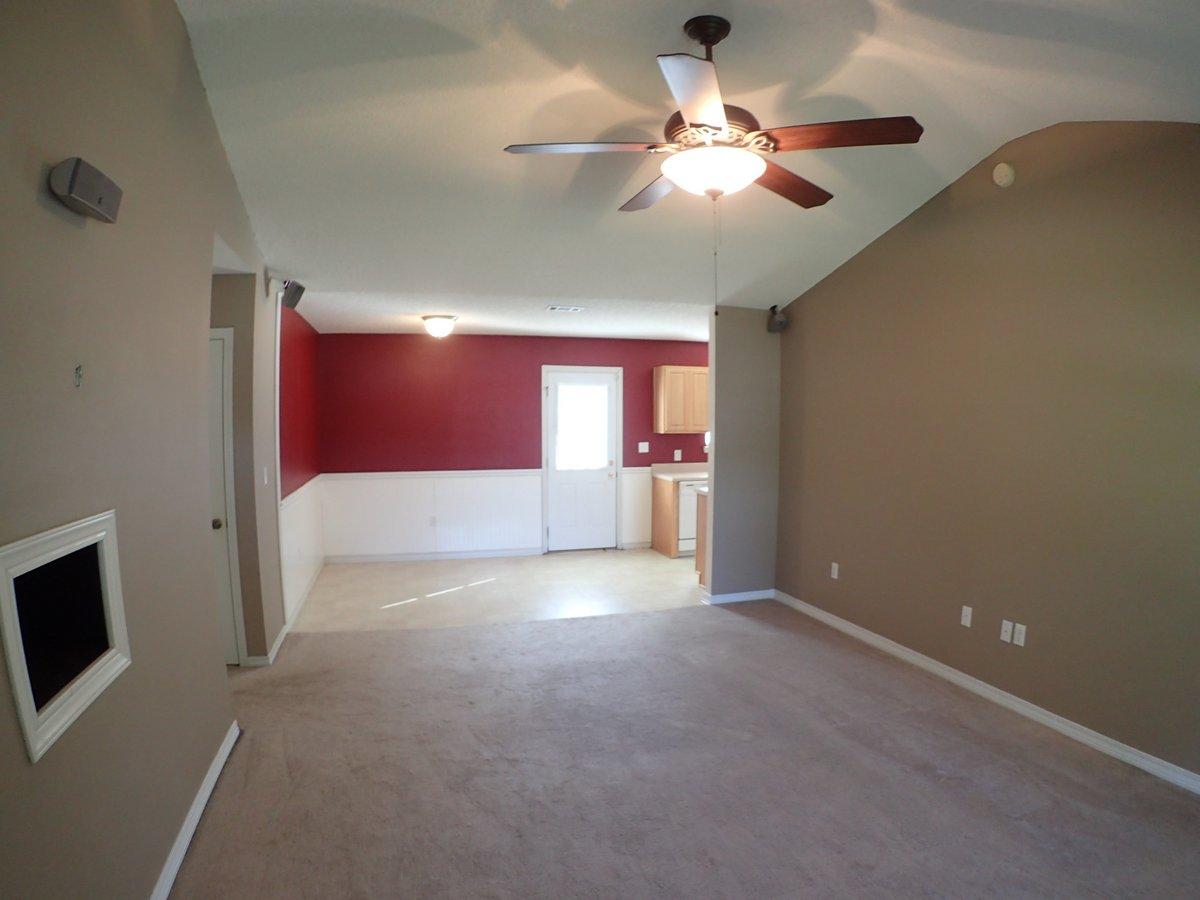 134 Hampton Drive Crestview, FL 32539 - Photo 2 of 17 a view of an empty room with a fireplace