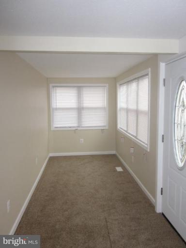 1120 North Point Road Dundalk, MD 21222 - Photo 12 of 14 an empty room with windows