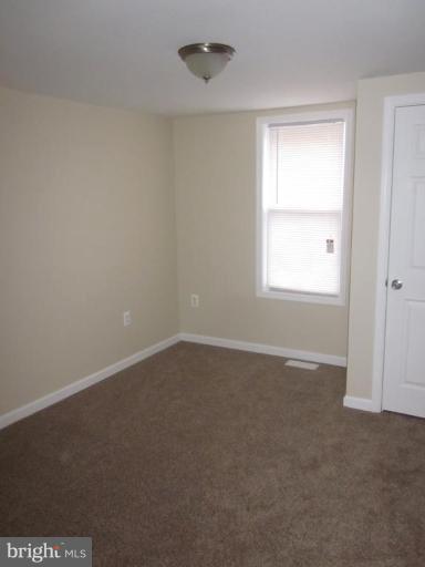 1120 North Point Road Dundalk, MD 21222 - Photo 3 of 14 an empty room with a window