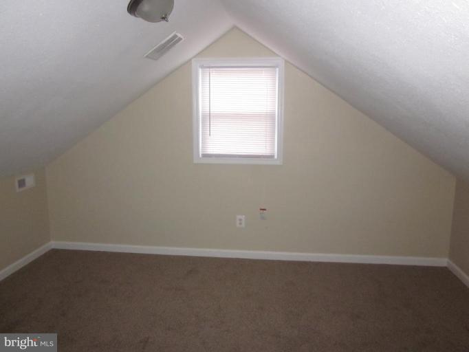 1120 North Point Road Dundalk, MD 21222 - Photo 6 of 14 an empty room with a window