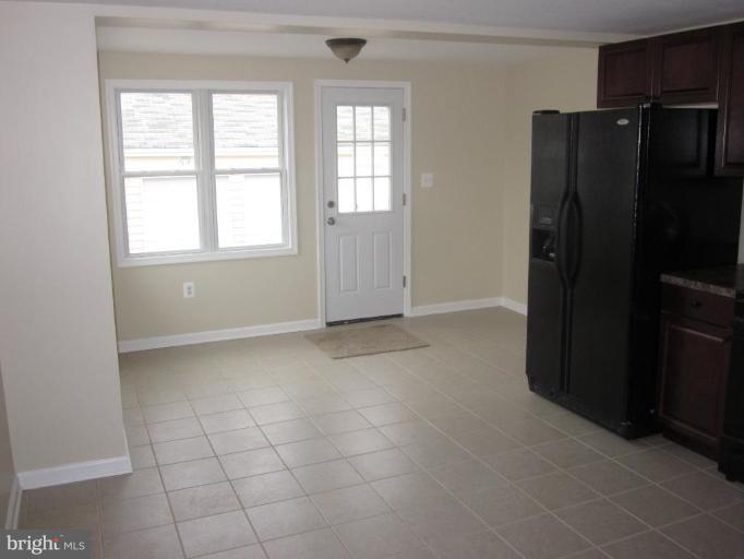1120 North Point Road Dundalk, MD 21222 - Photo 8 of 14 an empty room with windows and closet