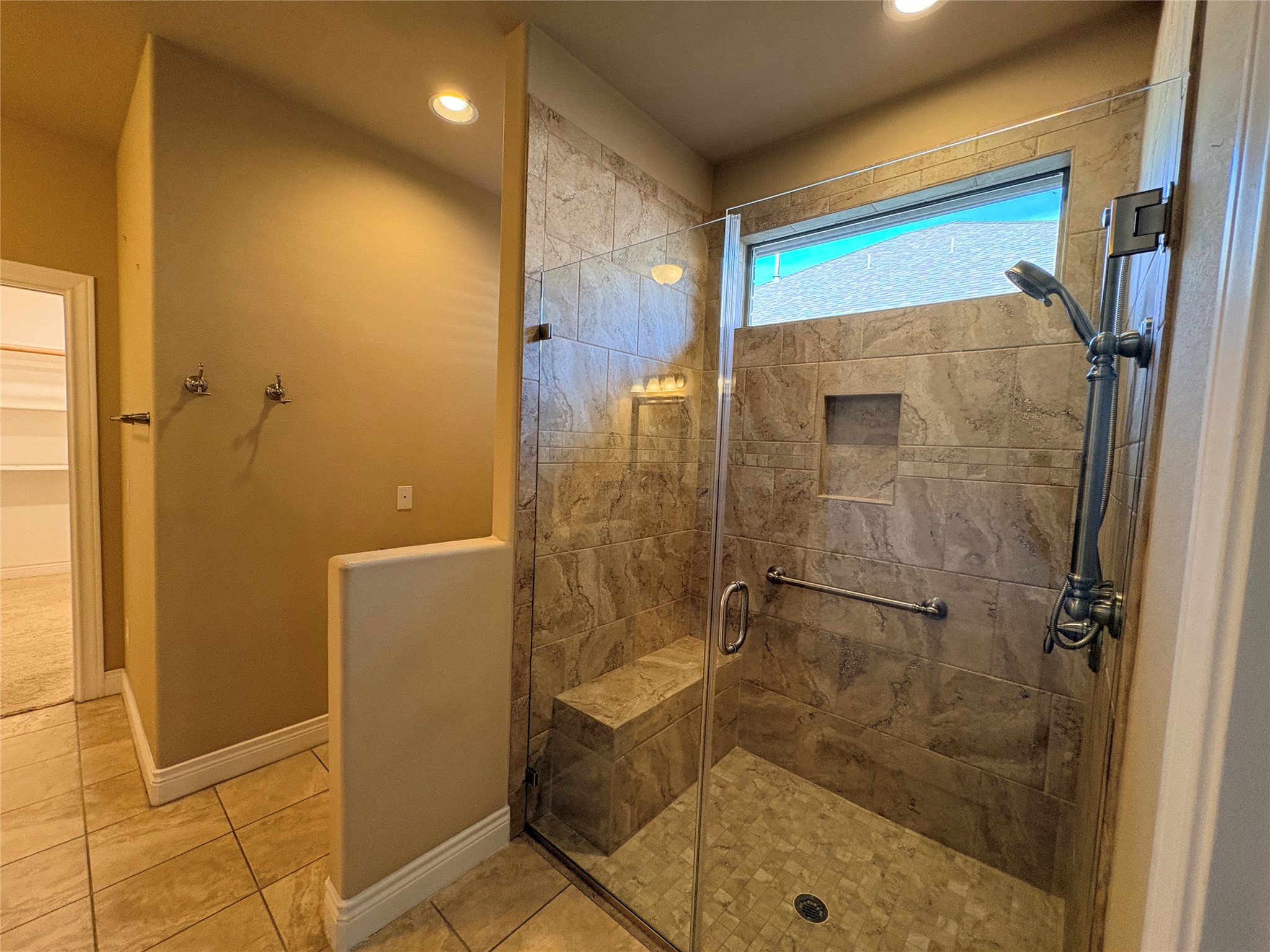 4802 Hidden Springs Trail Georgetown, TX 78633 - Photo 13 of 33 Walk in shower with grip bars and bench seat