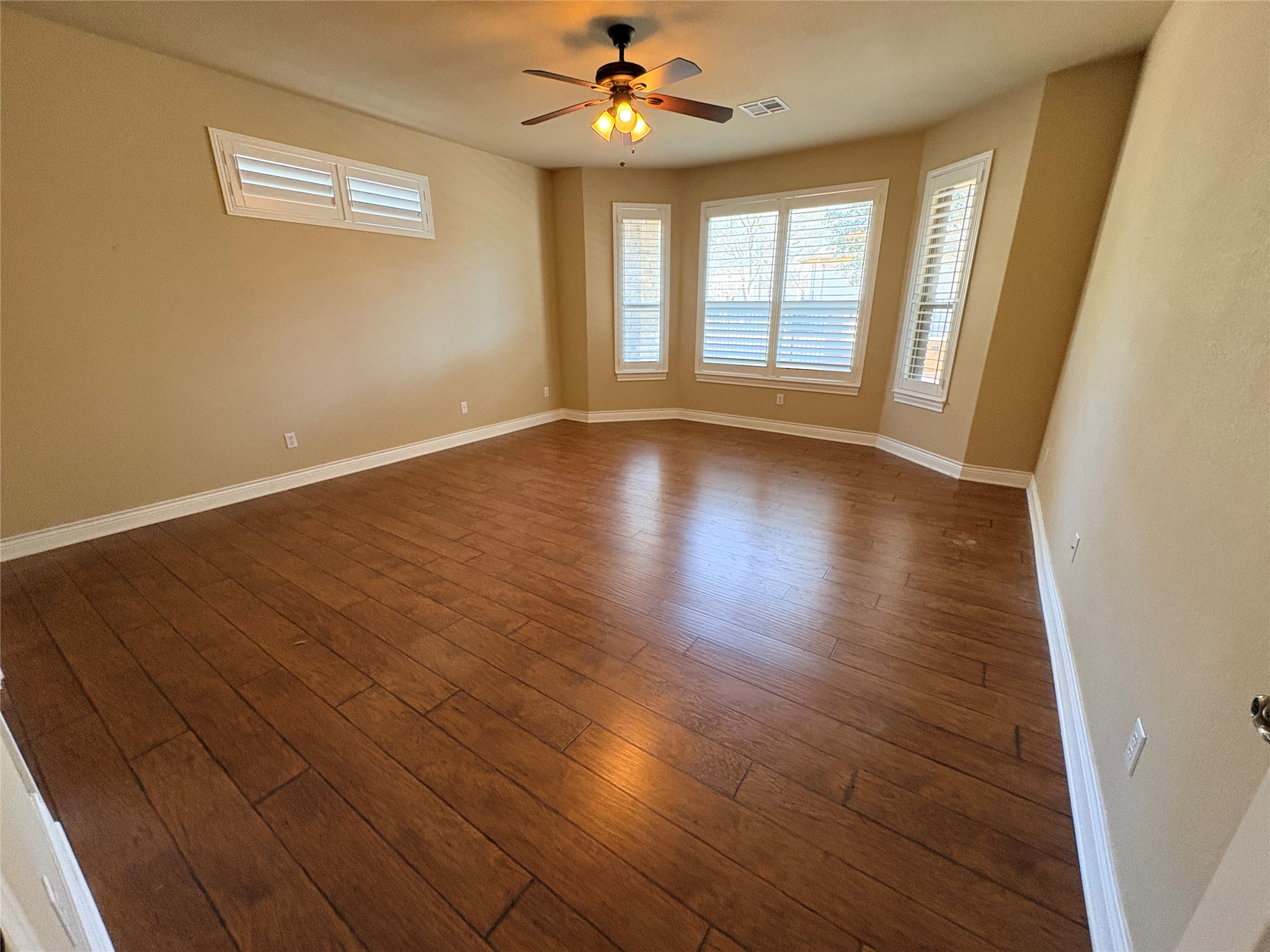 4802 Hidden Springs Trail Georgetown, TX 78633 - Photo 10 of 33 Master Bedroom offers a bay window and more of the beautiful wood floors.