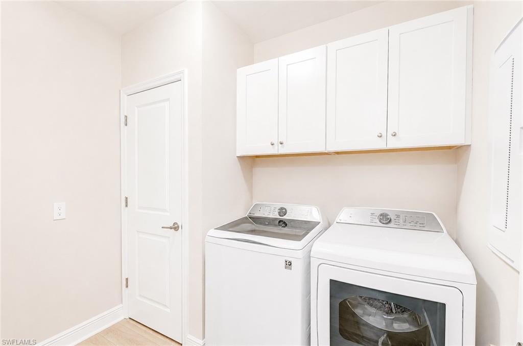 2620 Seychelles Circle, Unit 1302 Naples, FL 34112 - Photo 27 of 43 a utility room with dryer and washer