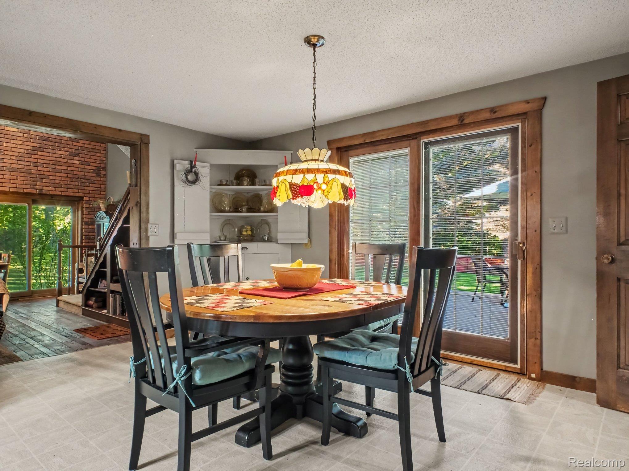 3284 Pratt Road Metamora, MI 48455 - Photo 9 of 22 Dining area with tile flooring and a built-in display cabinet