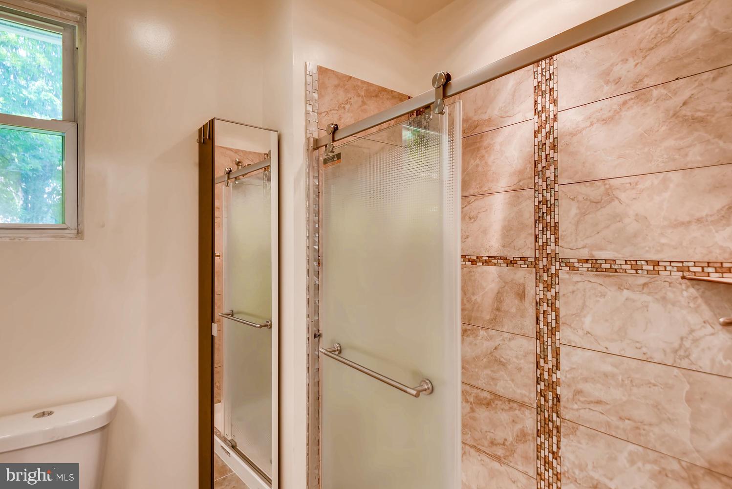 3719 Ridgecroft Road Baltimore, MD 21206 - Photo 4 of 28 Designer tile work in bathroom
