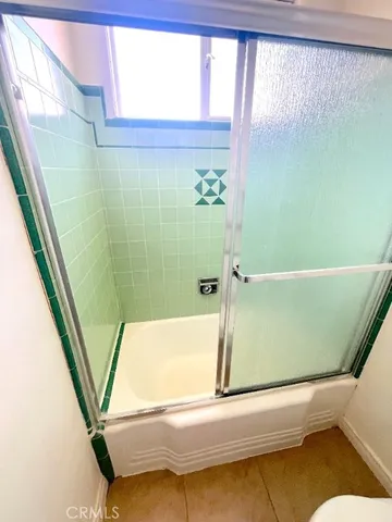 a bathroom with a sink and a shower