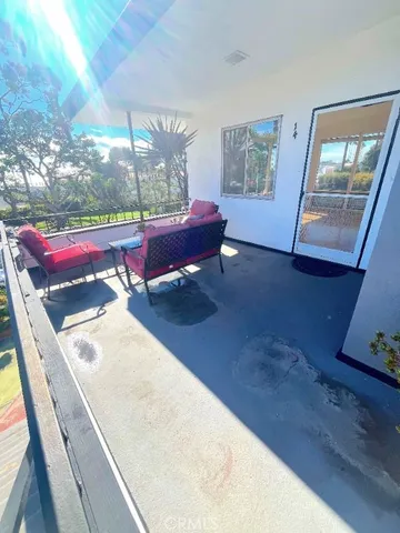 a view of a backyard with sitting area