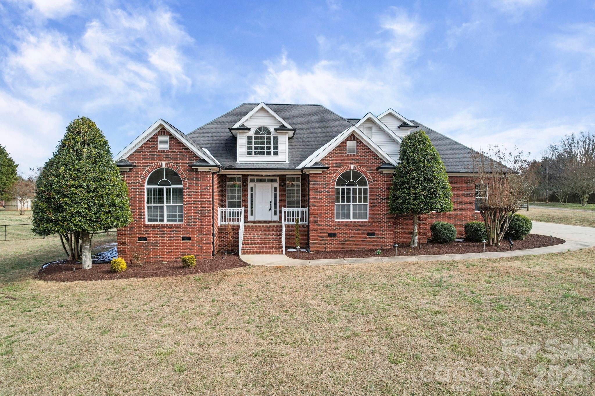 a front view of a house with a yard
