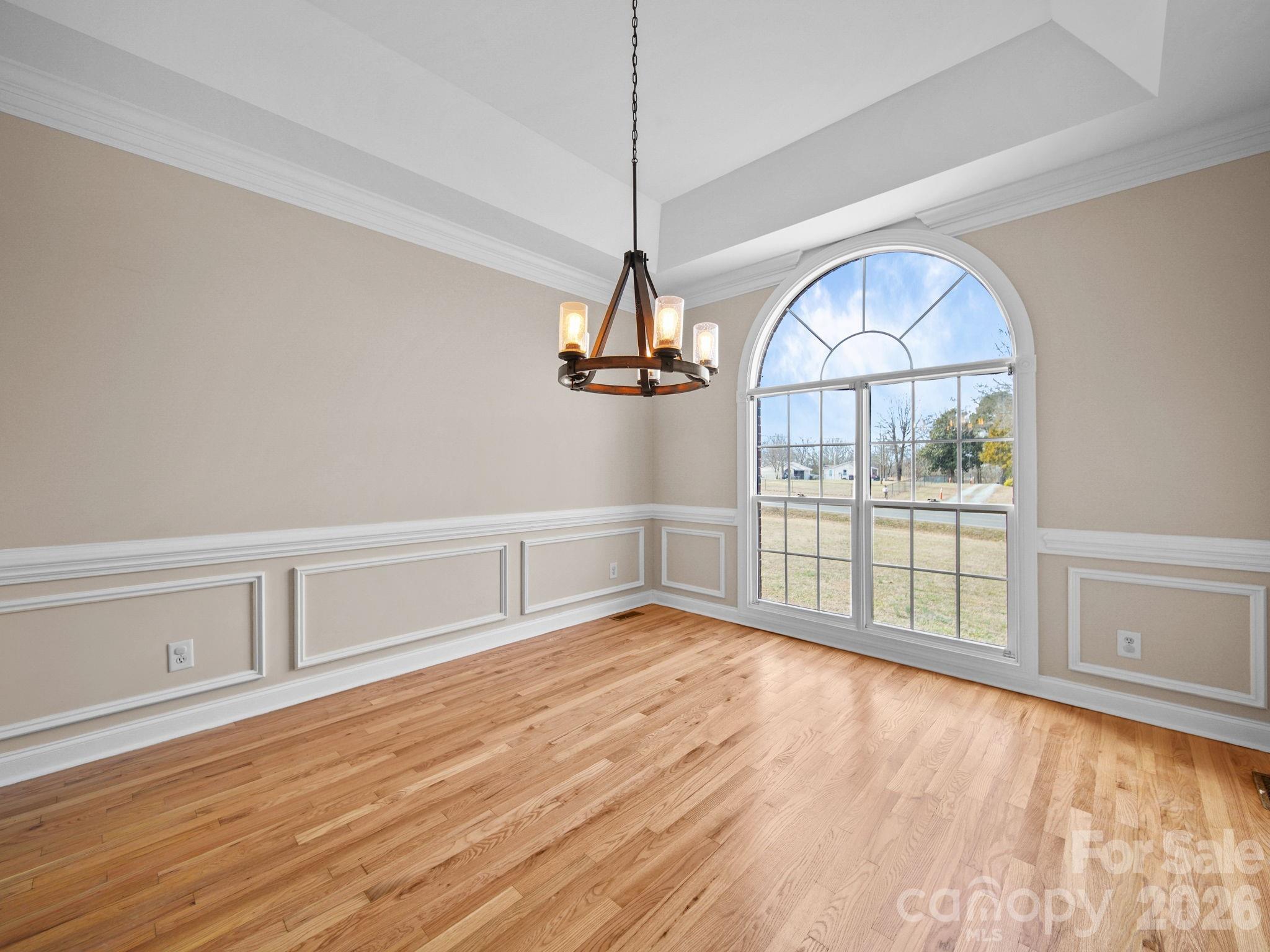 715 Witmore Road Wingate, NC 28174 - Photo 12 of 48 a view of empty room with wooden floor and fan