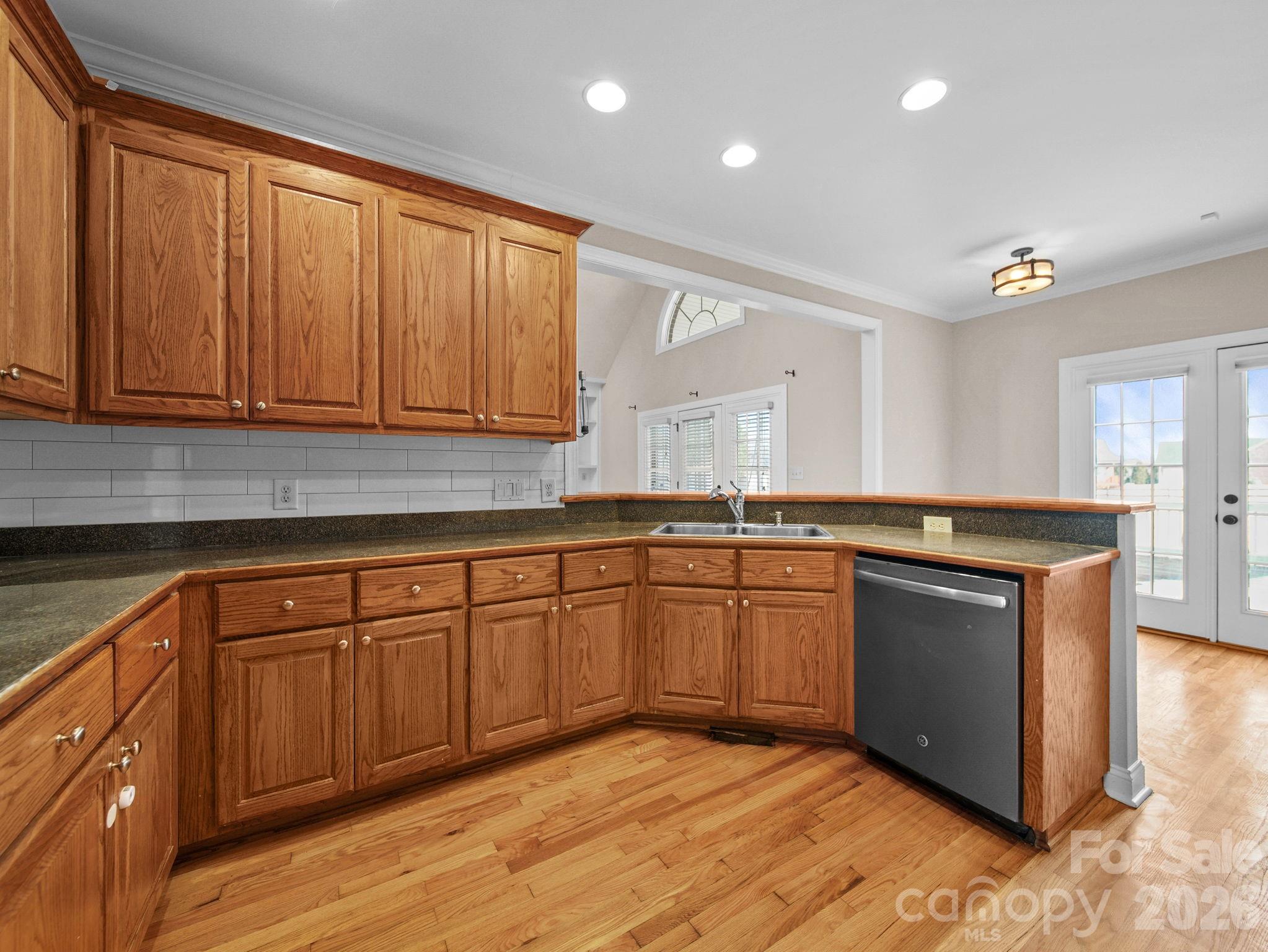 715 Witmore Road Wingate, NC 28174 - Photo 15 of 48 a kitchen with stainless steel appliances granite countertop a stove a sink and a microwave