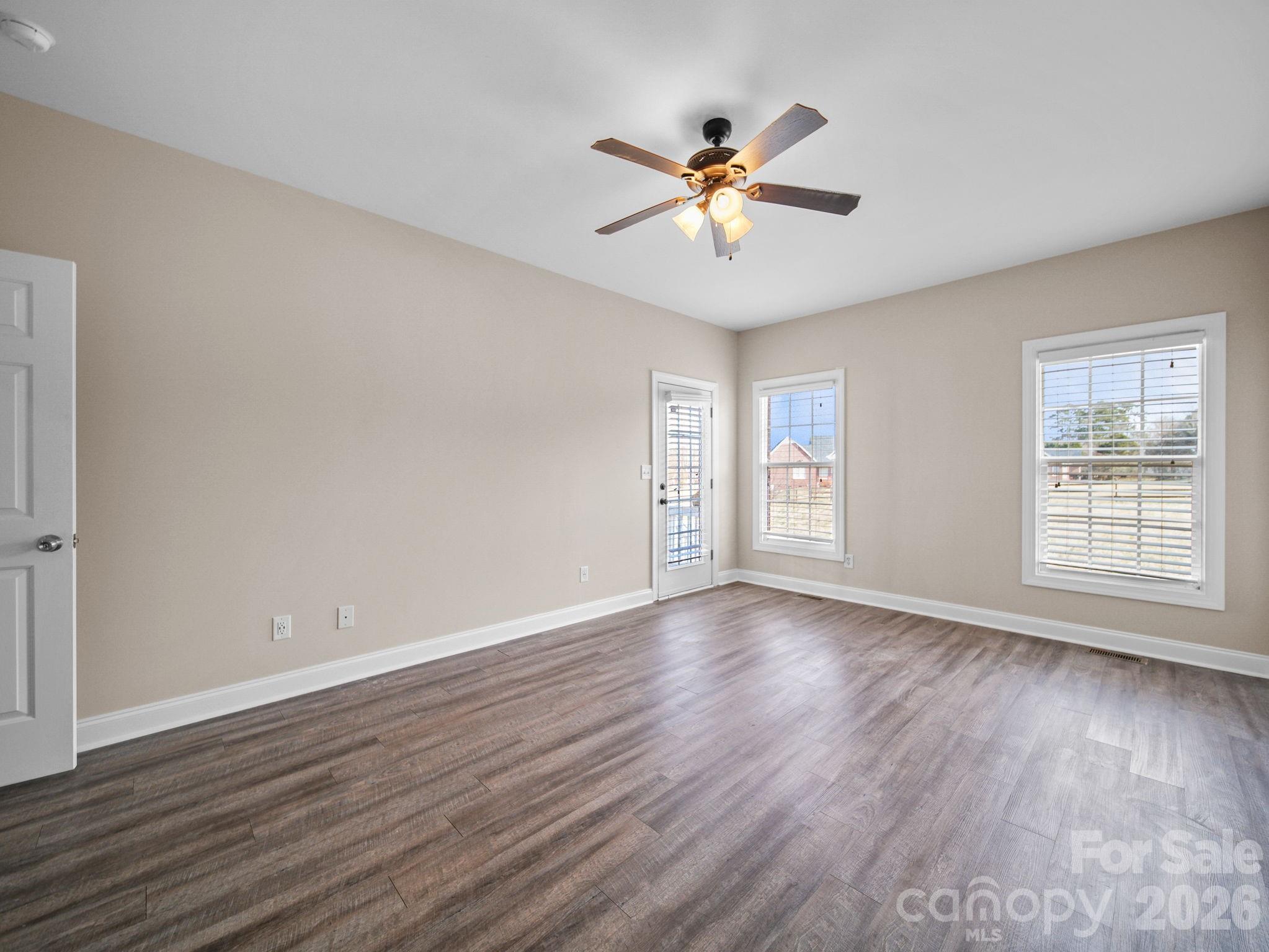 715 Witmore Road Wingate, NC 28174 - Photo 17 of 48 a view of an empty room with wooden floor and a window