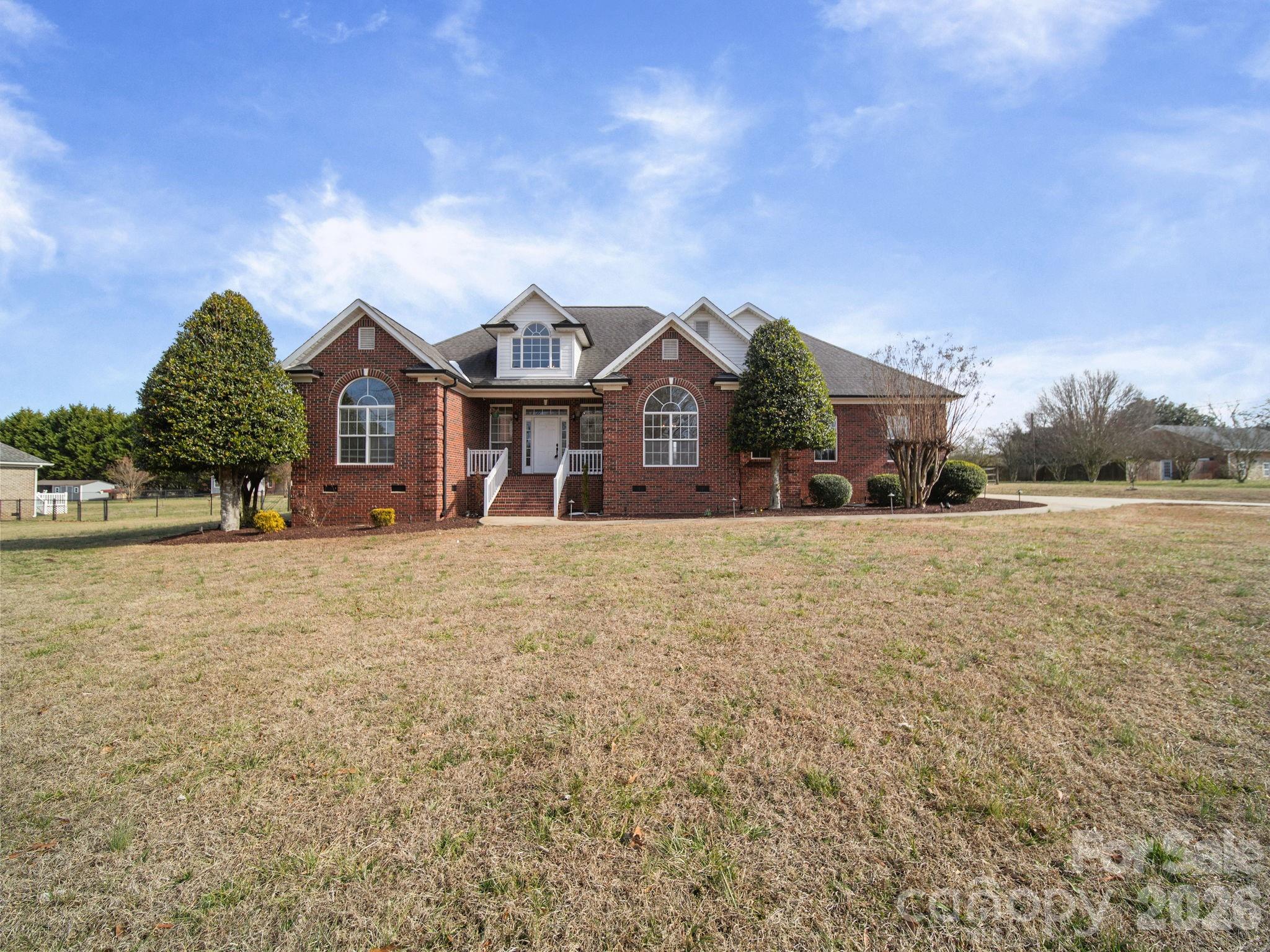 715 Witmore Road Wingate, NC 28174 - Photo 2 of 48 a front view of a house with a yard