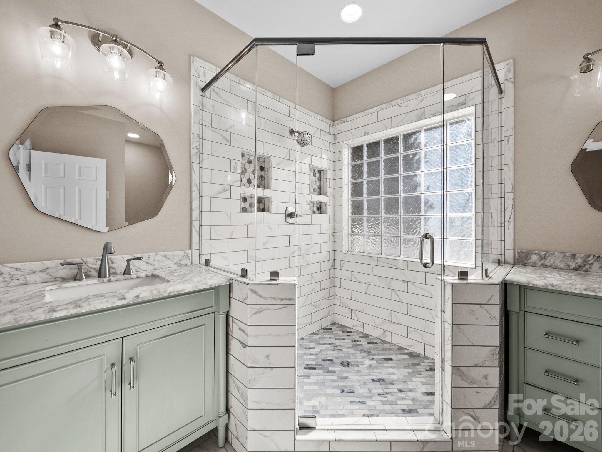 715 Witmore Road Wingate, NC 28174 - Photo 24 of 48 a bathroom with a double vanity sink mirror and shower