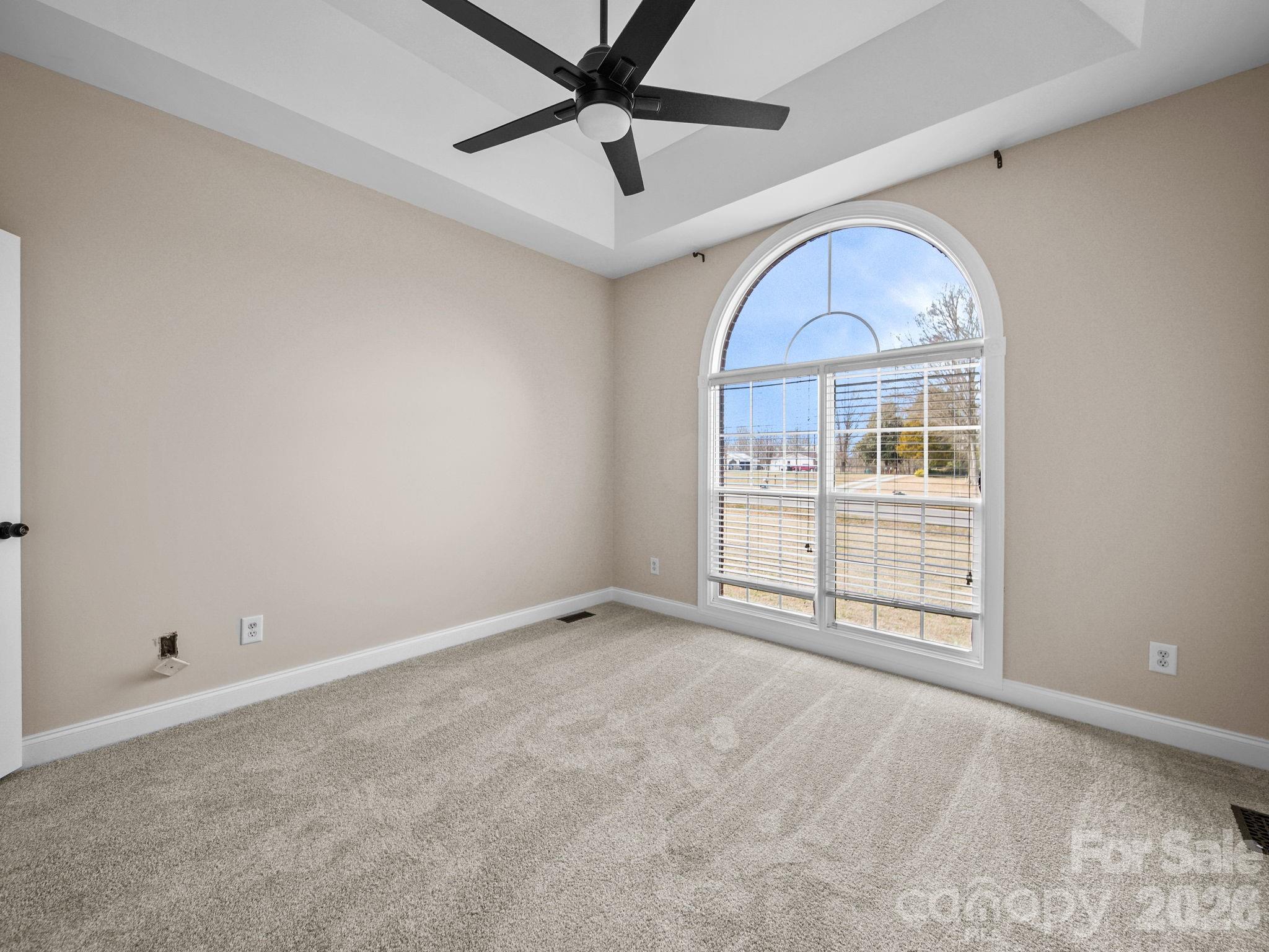 715 Witmore Road Wingate, NC 28174 - Photo 29 of 48 an empty room with ceiling fan and window