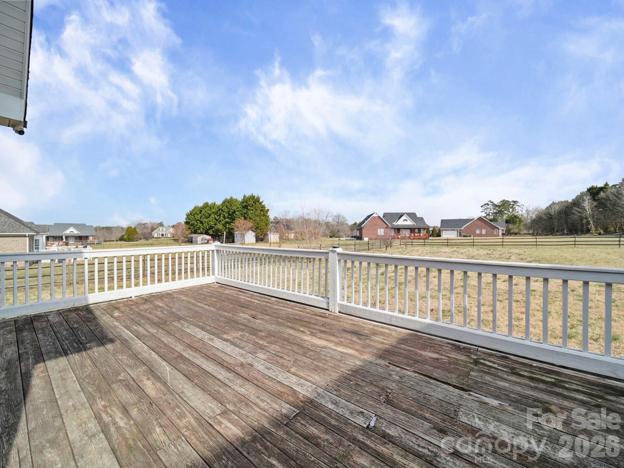 715 Witmore Road Wingate, NC 28174 - Photo 38 of 48 a view of a balcony with wooden floor and fence