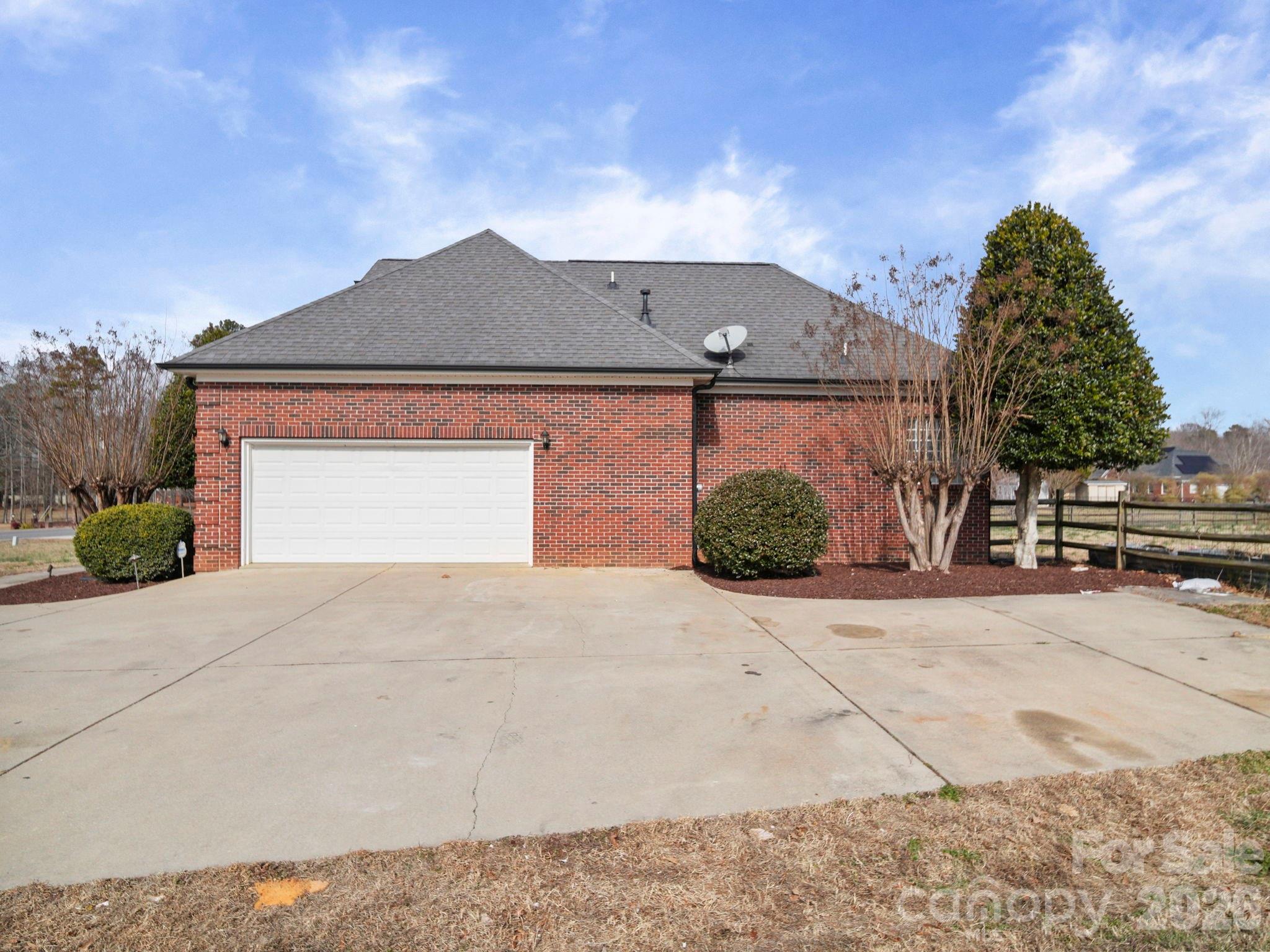 715 Witmore Road Wingate, NC 28174 - Photo 4 of 48 a front view of a house with a yard and garage