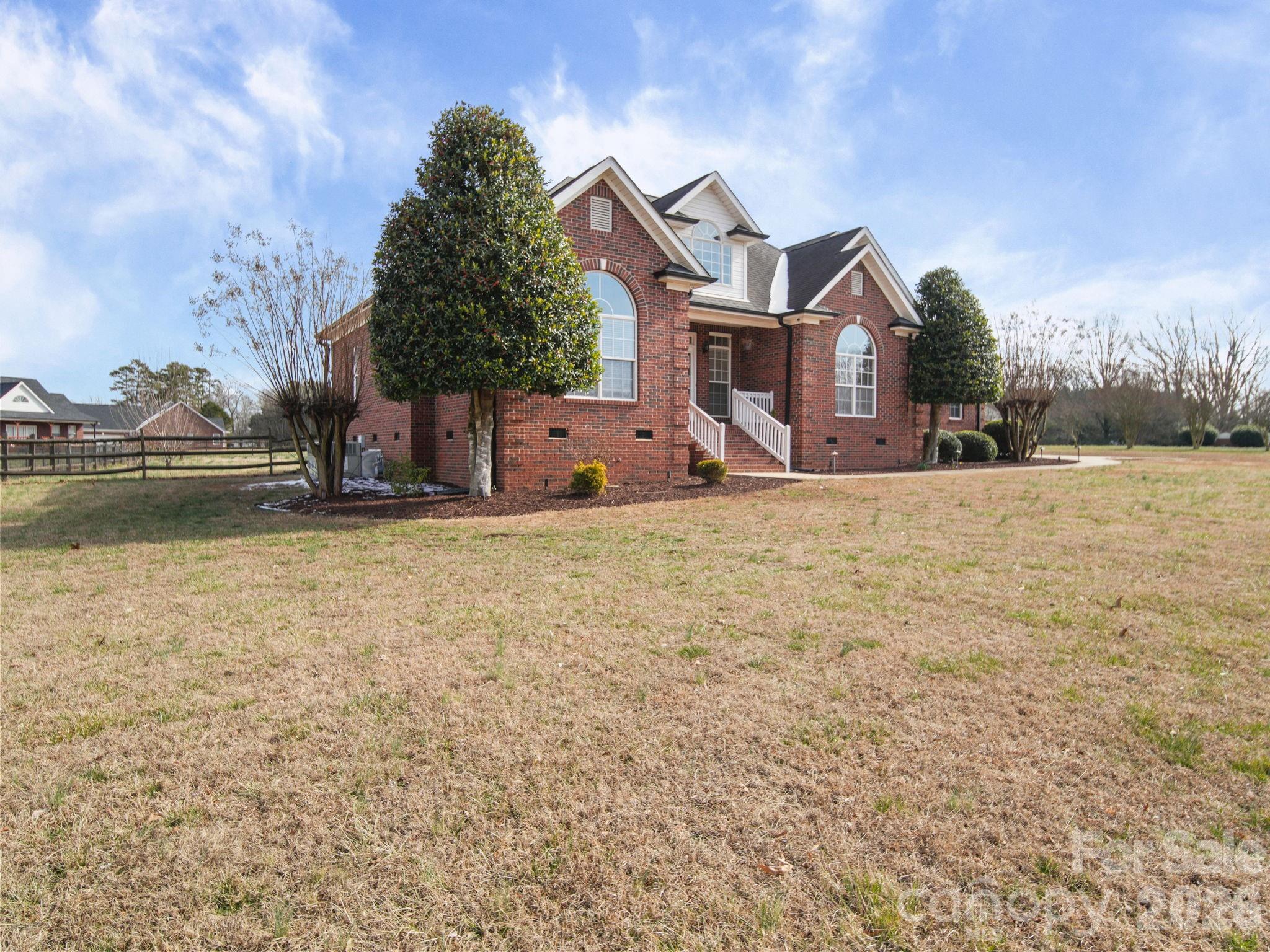 715 Witmore Road Wingate, NC 28174 - Photo 41 of 48 a front view of a house with a yard