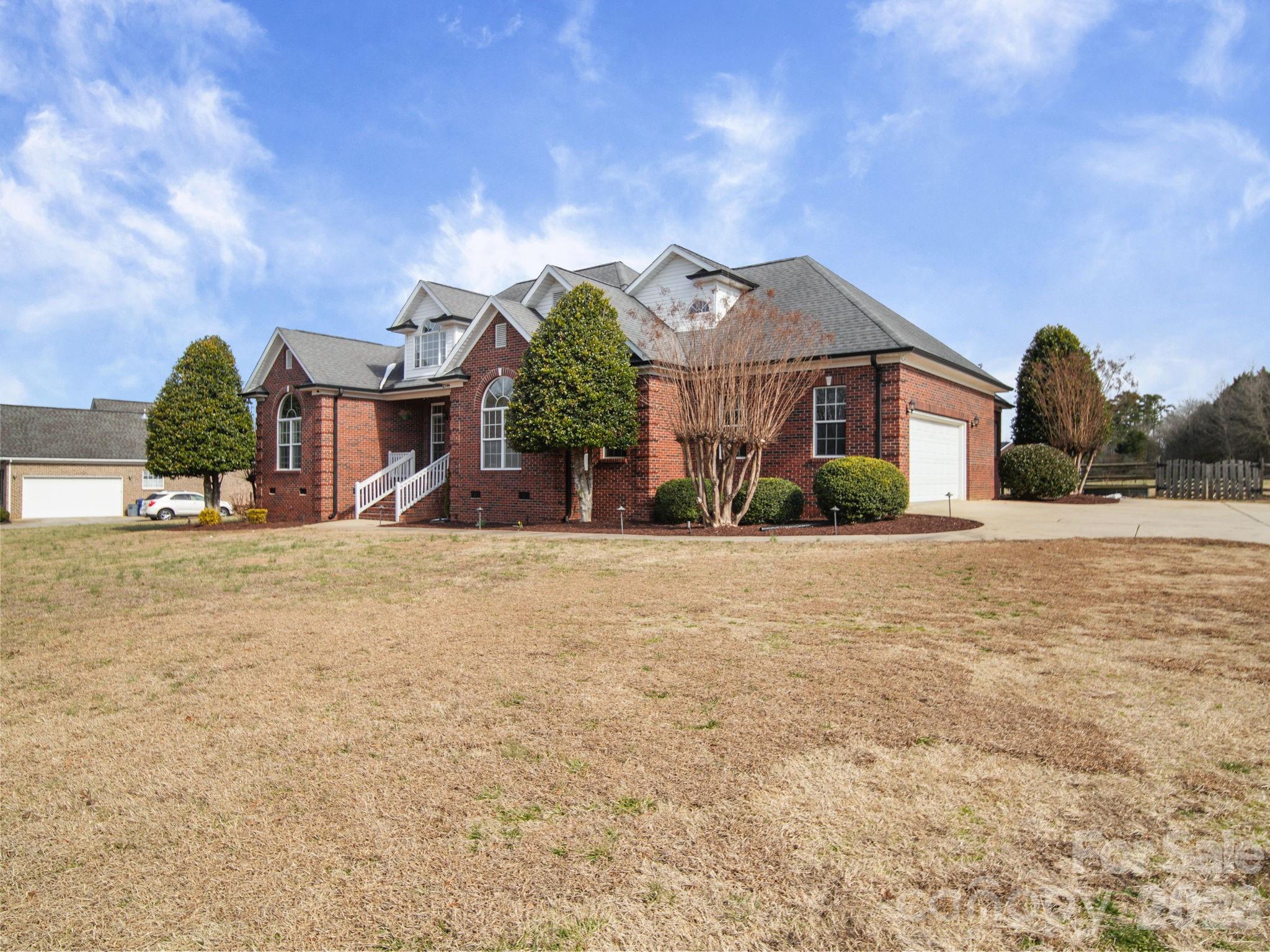 715 Witmore Road Wingate, NC 28174 - Photo 46 of 48 a front view of a house with a yard