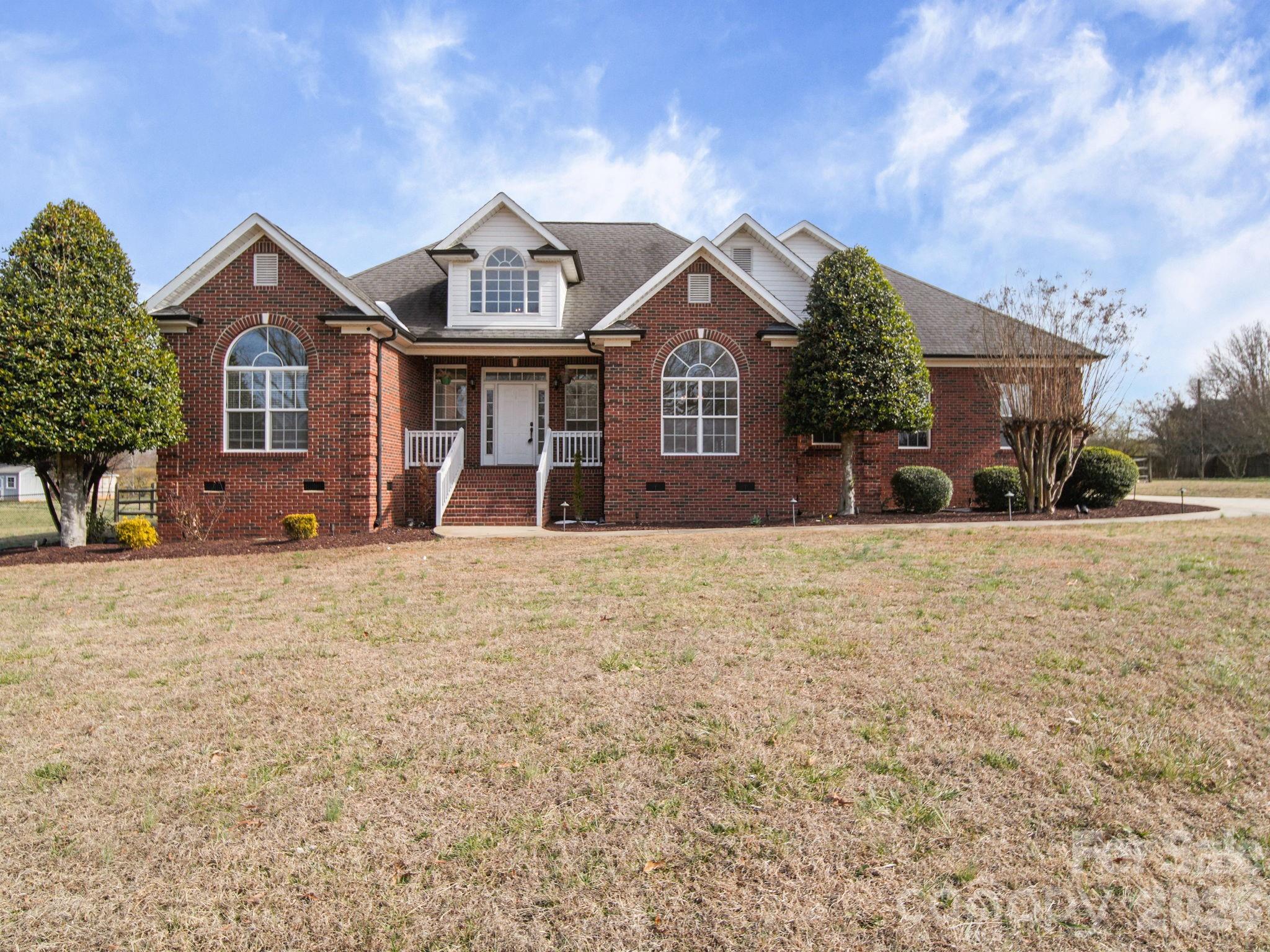 715 Witmore Road Wingate, NC 28174 - Photo 47 of 48 a front view of a house with a yard
