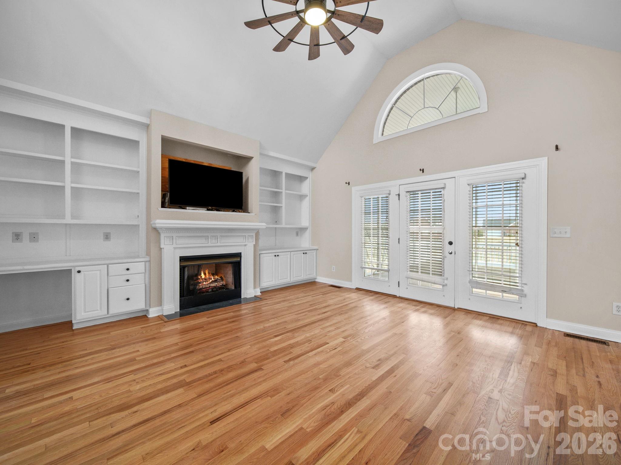 715 Witmore Road Wingate, NC 28174 - Photo 9 of 48 a view of an empty room with wooden floor fireplace and a window