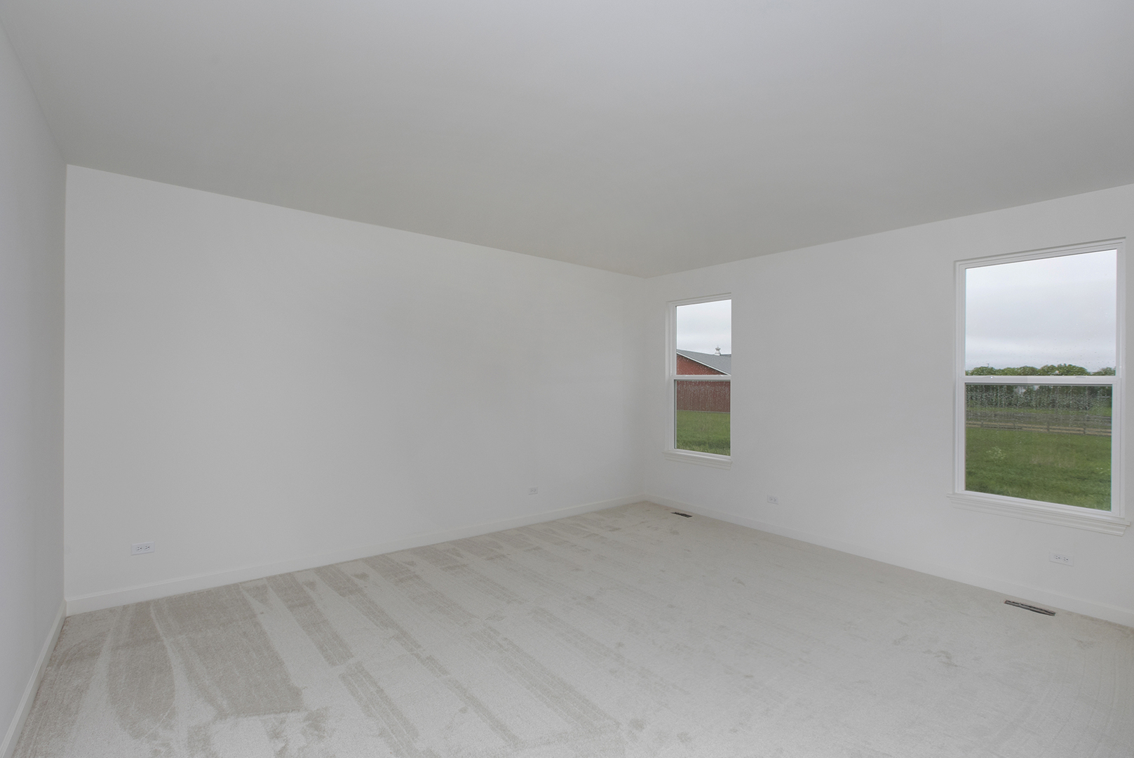 4398 Charles Dickens Road Elgin, IL 60124 - Photo 12 of 29 an empty room with windows
