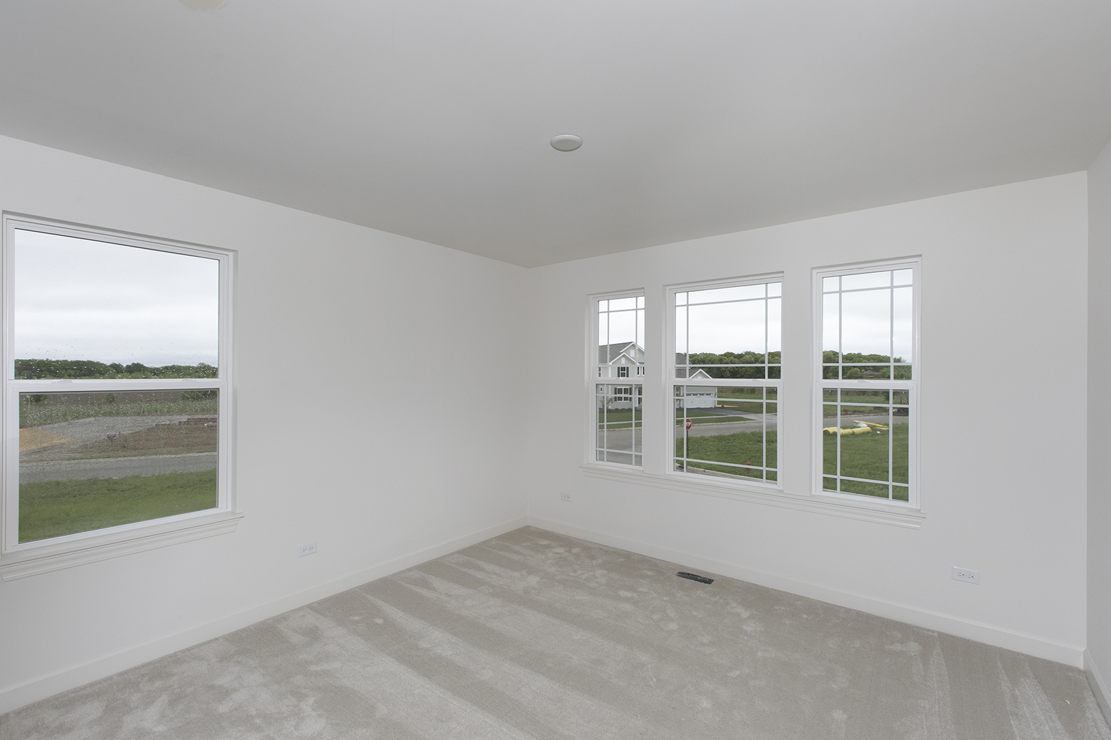 4398 Charles Dickens Road Elgin, IL 60124 - Photo 14 of 29 an empty room with windows