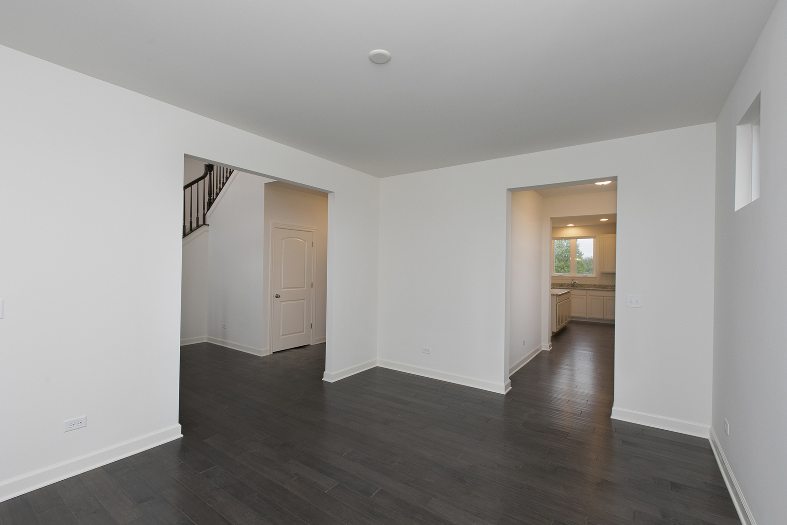 4398 Charles Dickens Road Elgin, IL 60124 - Photo 5 of 29 a view of an empty room with wooden floor and a window