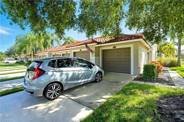 a view of a car in front of a house