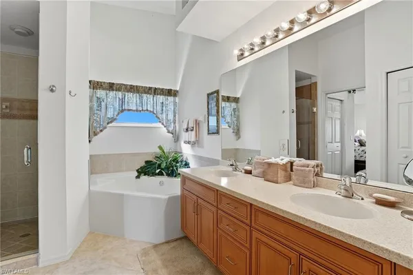 a bathroom with a double vanity sink mirror and double