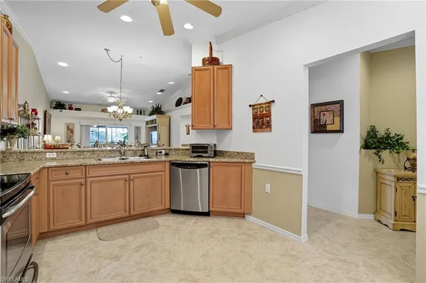 a kitchen with a sink and refrigerator