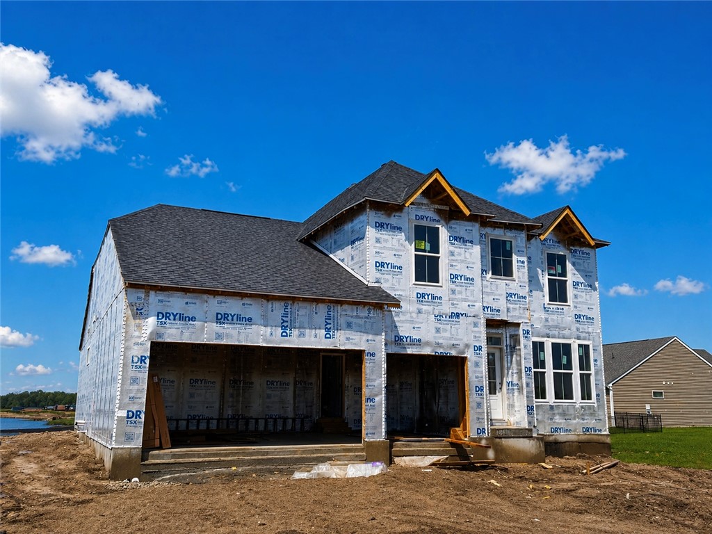 405 South Landon Lane Springfield, OH 45502 - Photo 1 of 8 This newly framed home awaits its finishing touches under a bright sky.