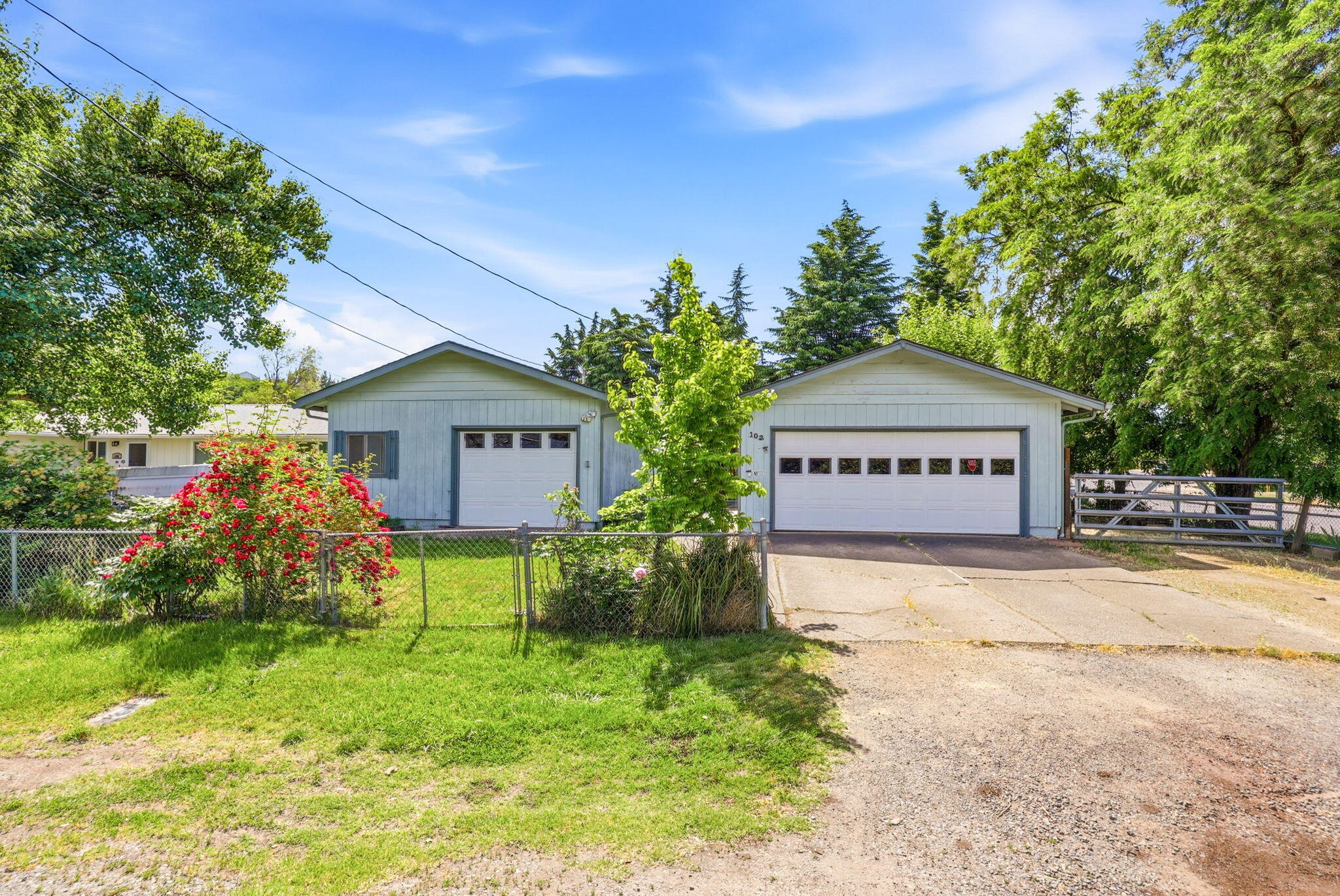 102 Elm Street Phoenix, OR 97535 - Photo 3 of 28 a view of a house with a yard and tree s