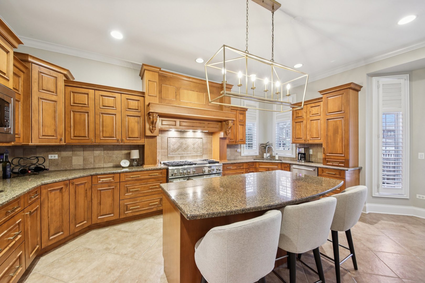 1135 North Main Street Naperville, IL 60563 - Photo 11 of 52 a kitchen with a table chairs sink and cabinets