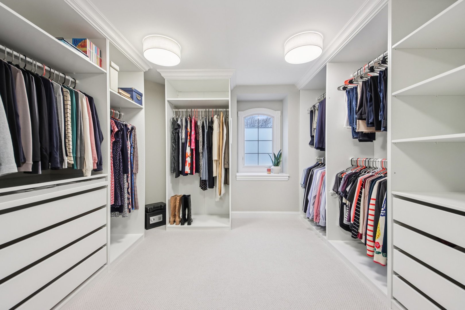 1135 North Main Street Naperville, IL 60563 - Photo 35 of 52 a view of walk in closet with clothes and shoes