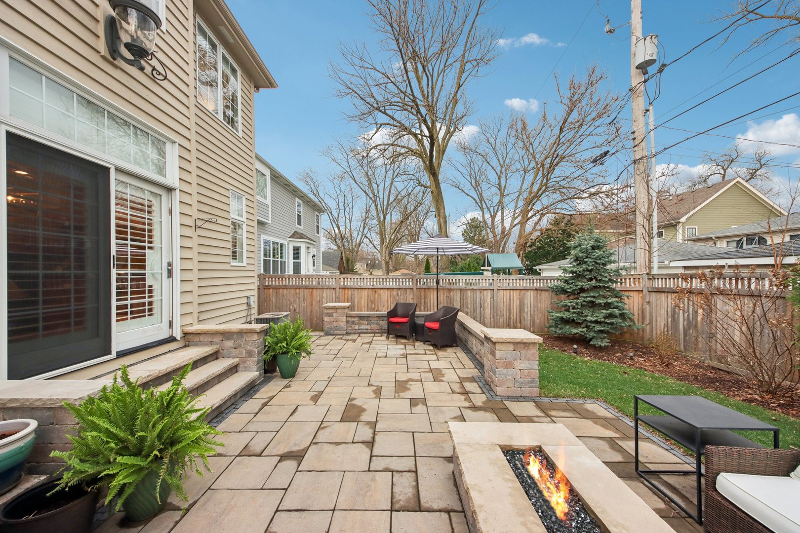 1135 North Main Street Naperville, IL 60563 - Photo 46 of 52 a view of a patio with table and chairs and potted plants