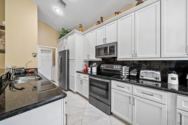 a view of walk in closet with clothes