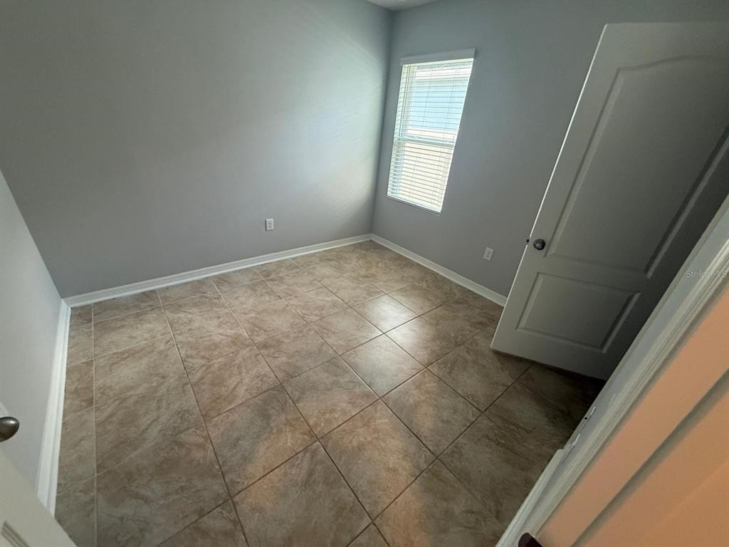 754 Chinoy Road Davenport, FL 33837 - Photo 7 of 26 a view of empty room