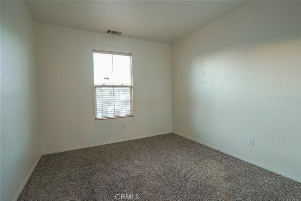 15133 Pasture Way Victorville, CA 92394 - Photo 26 of 48 an empty room with a window