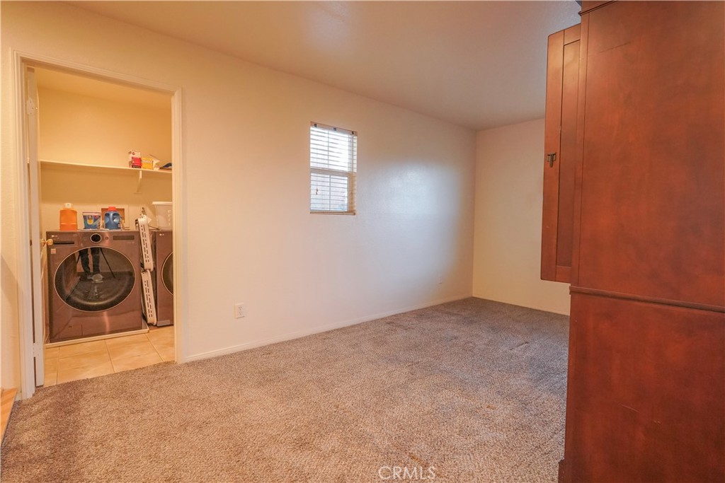 15133 Pasture Way Victorville, CA 92394 - Photo 28 of 48 a view of a livingroom with washer and dryer