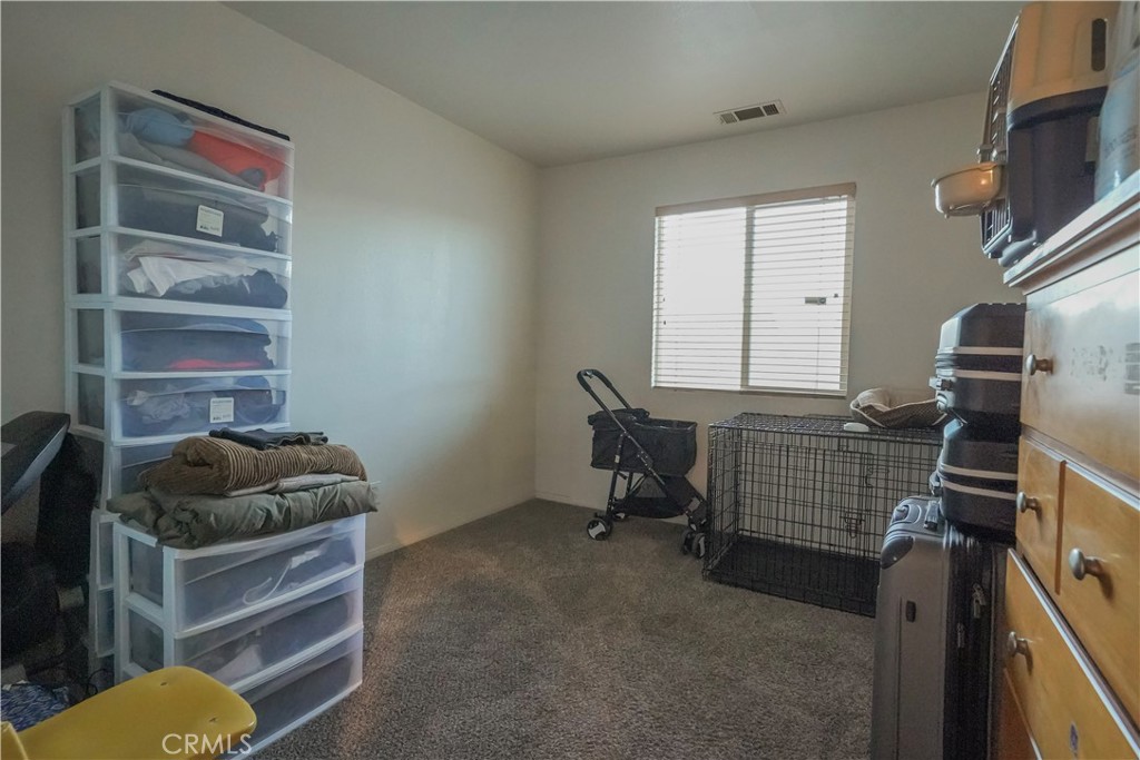 15133 Pasture Way Victorville, CA 92394 - Photo 33 of 48 a livingroom with furniture and a window