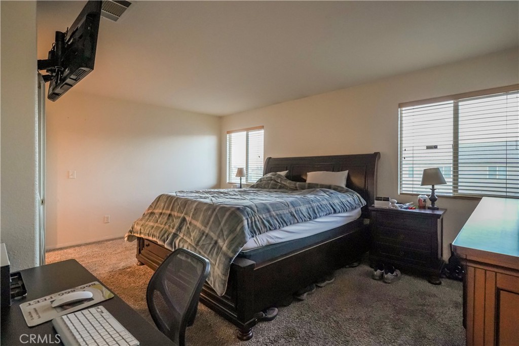 15133 Pasture Way Victorville, CA 92394 - Photo 39 of 48 a bedroom with a bed and a window