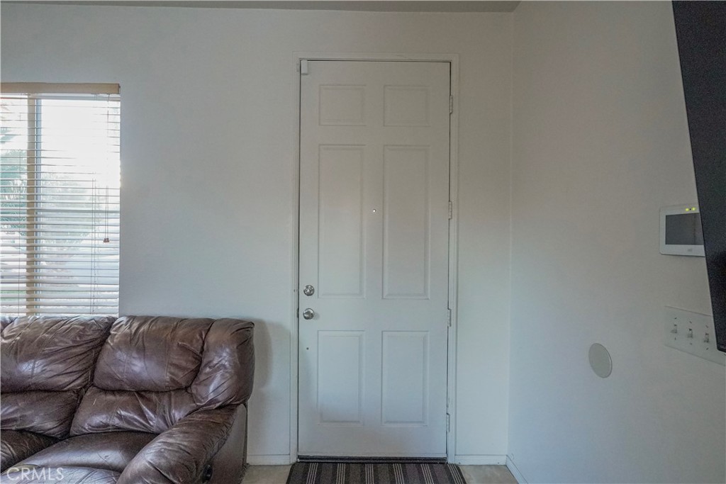 15133 Pasture Way Victorville, CA 92394 - Photo 7 of 48 a living room with furniture and a window