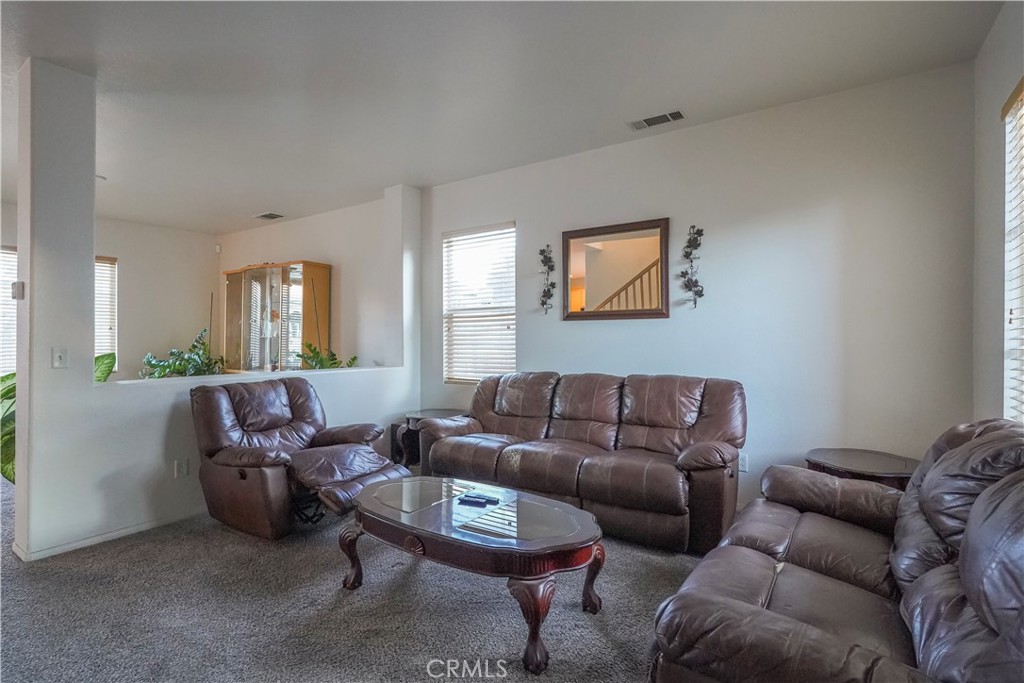 15133 Pasture Way Victorville, CA 92394 - Photo 8 of 48 a living room with furniture a couch and a window