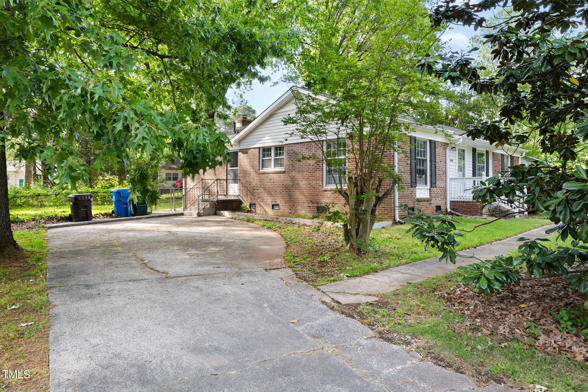 5802 Newhall Road Durham, NC 27713 - Photo 2 of 4 a view of a house with a tree in front of it
