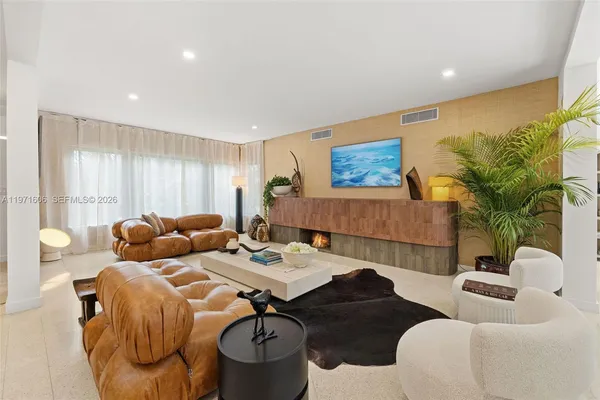 a large kitchen with stainless steel appliances lots of counter space and windows