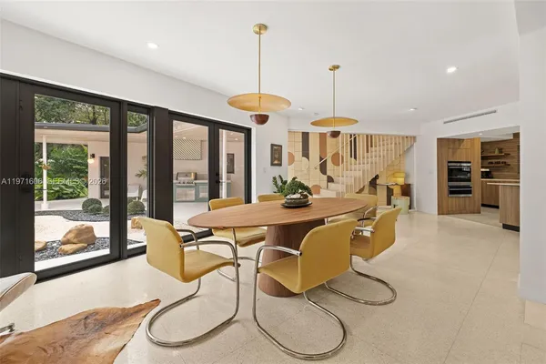 a view of staircase with open kitchen