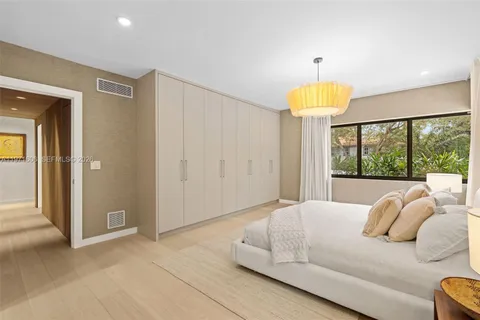 a view of living room kitchen and entryway