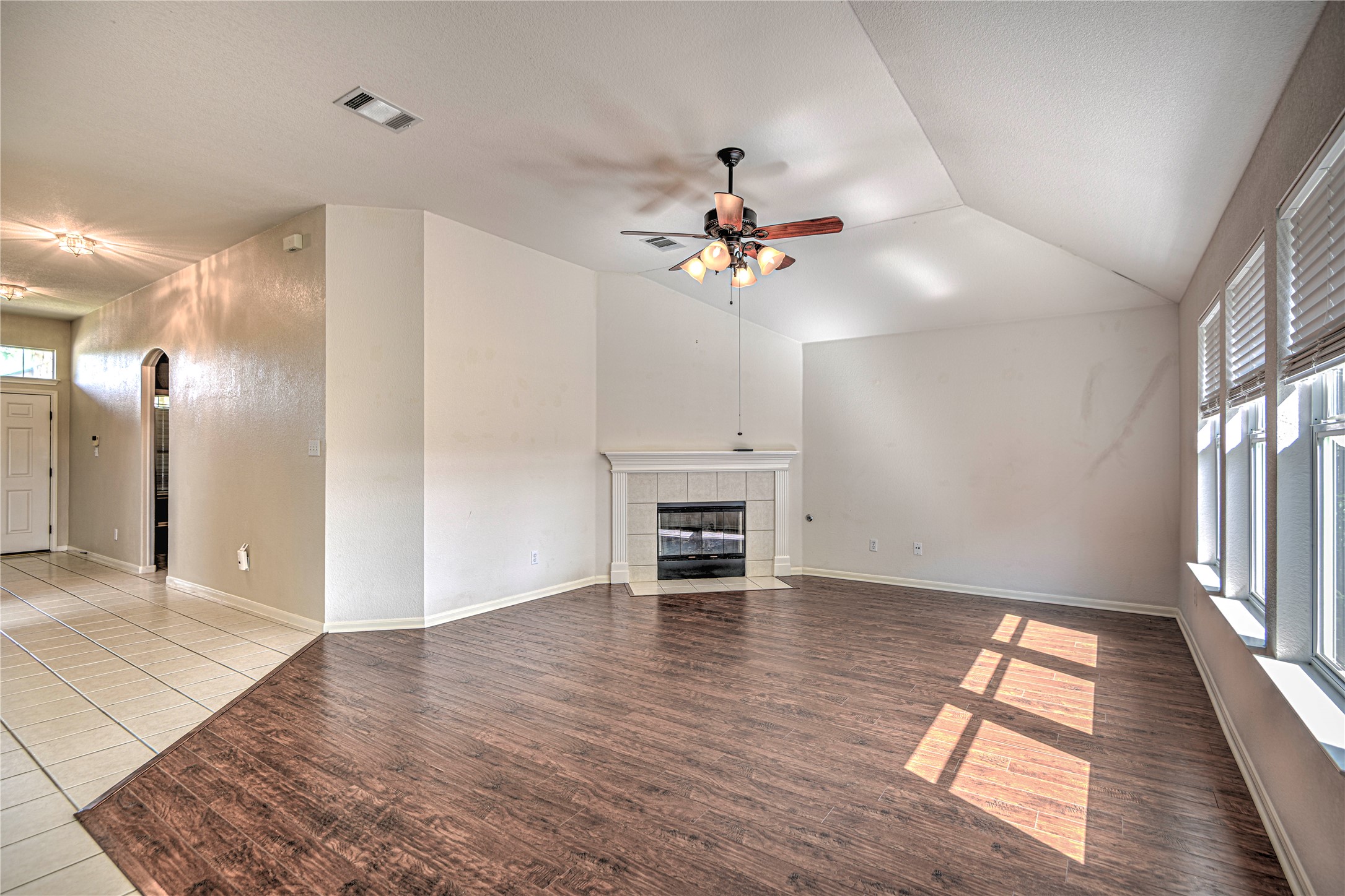 1900 Rutherford Drive Leander, TX 78641 - Photo 12 of 38 wooden floor in an empty room with a window